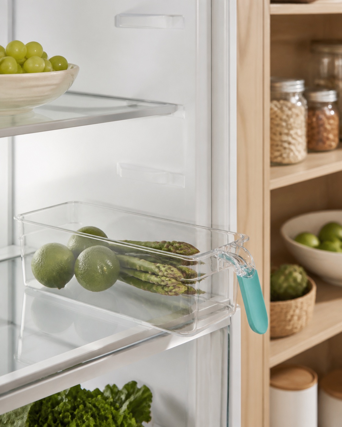 Clear refrigerator organization bin in a modern pantry